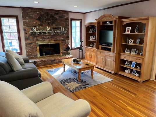 Fireplace, Interior, Living room, Recessed Lighting, Stone Walls, Wood Texture Flooring
