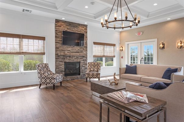 Chandelier, Fireplace, Interior, Living room, Recessed Lighting, Stone Walls, Wood Texture Flooring