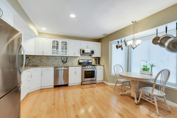 Chandelier, Dining room, Interior, Kitchen, Recessed Lighting, Stainless Steel Appliances, Wood Texture Flooring