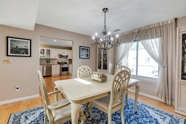 Chandelier, Dining room, Interior, Kitchen, Recessed Lighting, Stainless Steel Appliances, Wood Texture Flooring