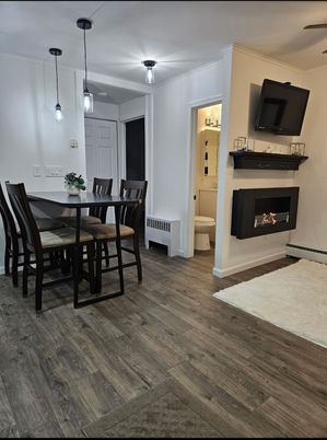Dining room, Fireplace, Interior, Pendant Lights, Wood Texture Flooring