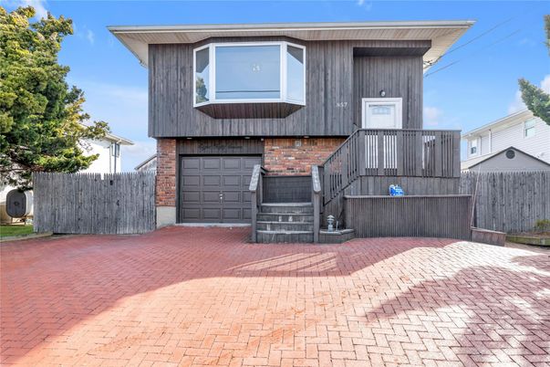 Attached, Exterior, Facade, Brick Facade, Modern