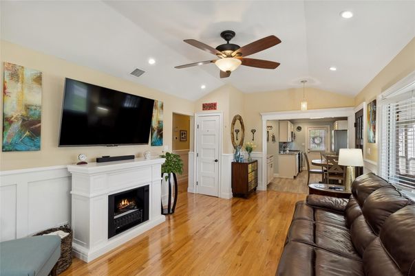 Dining room, Fireplace, Interior, Living room, Pendant Lights, Recessed Lighting, Wood Texture Flooring