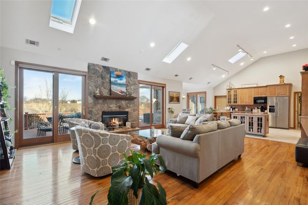 Fireplace, Interior, Kitchen, Living room, Recessed Lighting, Stainless Steel Appliances, Stone Walls, Wood Texture Flooring