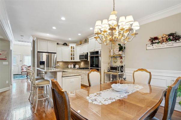 Chandelier, Dining room, Interior, Kitchen, Recessed Lighting, Stainless Steel Appliances, Wood Texture Flooring