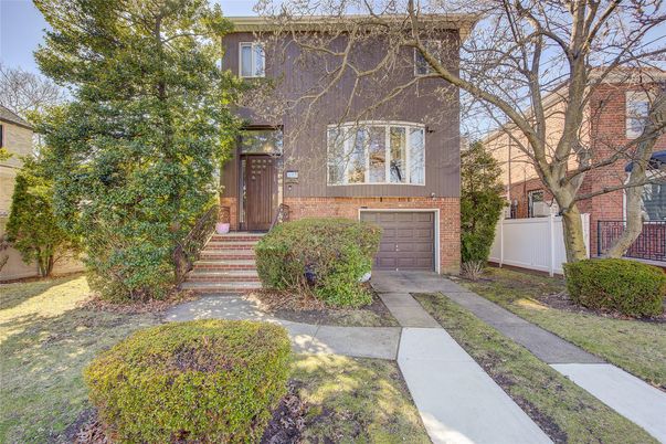Attached, Exterior, Facade, Brick Facade, American Foursquare