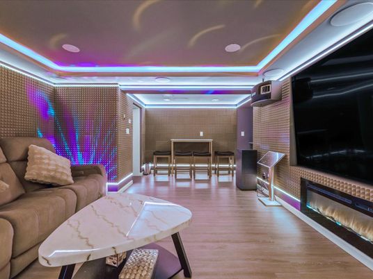 Dining room, Fireplace, Interior, Living room, Recessed Lighting, Stone Walls, Wood Texture Flooring