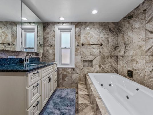 Bathroom, Dual Sink Vanities, Interior, Marble, Marble Walls, Recessed Lighting