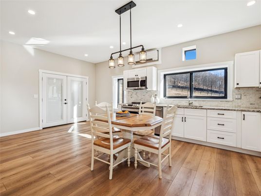 Dining room, Interior, Kitchen, Pendant Lights, Recessed Lighting, Stainless Steel Appliances, Wood Texture Flooring