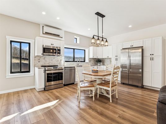 Dining room, Interior, Kitchen, Pendant Lights, Recessed Lighting, Stainless Steel Appliances, Wood Texture Flooring