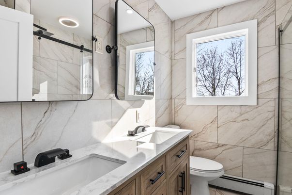Bathroom, Dual Sink Vanities, Glass Shower, Interior, Marble Walls, Recessed Lighting