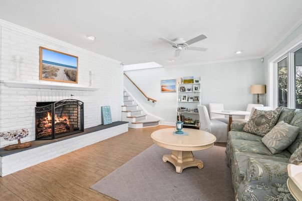 Dining room, Fireplace, Interior, Living room, Recessed Lighting, Stone Walls, Wood Texture Flooring