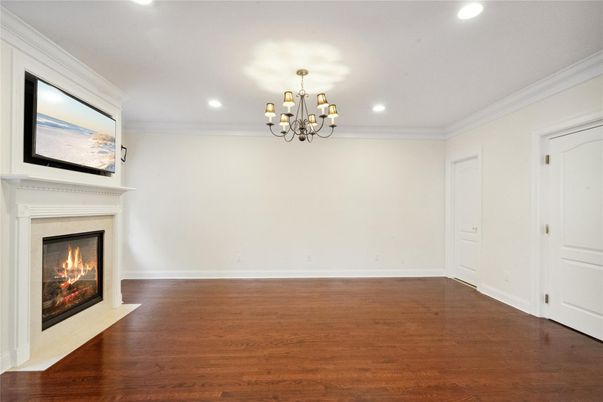 Chandelier, Empty room, Fireplace, Interior, Recessed Lighting, Wood Texture Flooring