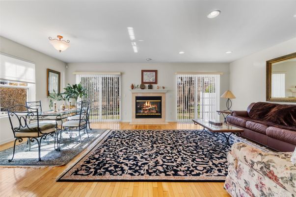 Dining room, Fireplace, Interior, Living room, Recessed Lighting, Wood Texture Flooring