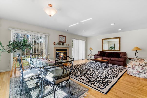 Dining room, Fireplace, Interior, Living room, Recessed Lighting, Wood Texture Flooring