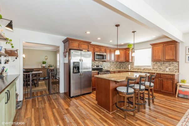 Dining room, Interior, Kitchen, Pendant Lights, Recessed Lighting, Stainless Steel Appliances, Wood Texture Flooring