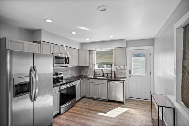 Interior, Kitchen, Recessed Lighting, Stainless Steel Appliances, Wood Texture Flooring