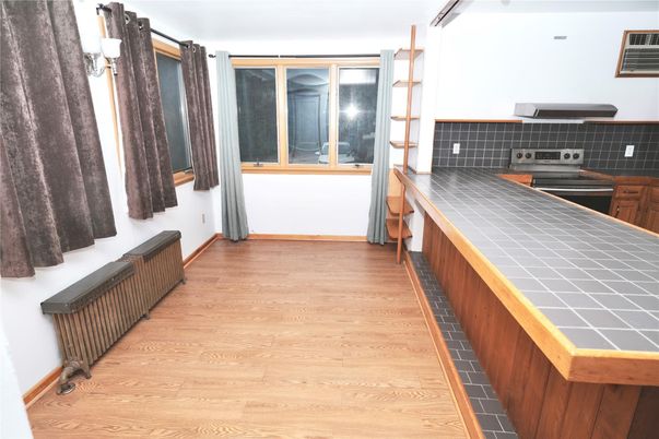 Interior, Kitchen, Tile Countertops, Wood Texture Flooring