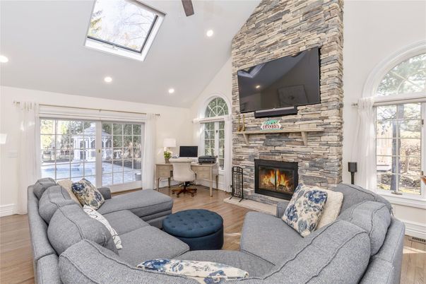 Fireplace, Home Office, Interior, Living room, Recessed Lighting, Stone Walls, Wooden Beams, Wood Texture Flooring