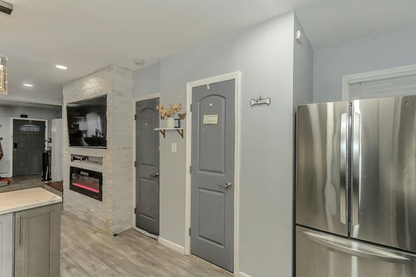Fireplace, Interior, Kitchen, Recessed Lighting, Stainless Steel Appliances, Wood Texture Flooring