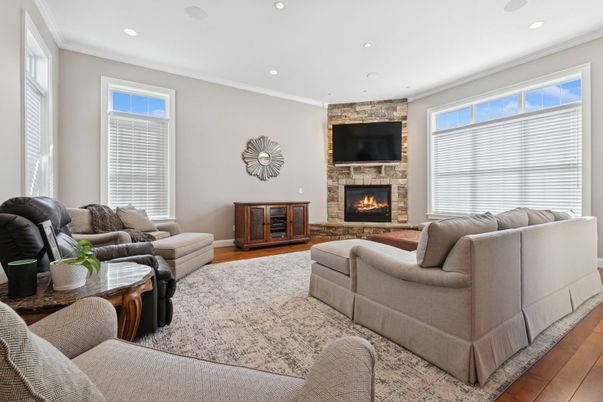 Fireplace, Interior, Living room, Recessed Lighting, Stone Walls, Wood Texture Flooring