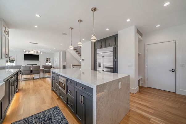 Dining room, Interior, Kitchen, Pendant Lights, Recessed Lighting, Stainless Steel Appliances, Wood Texture Flooring