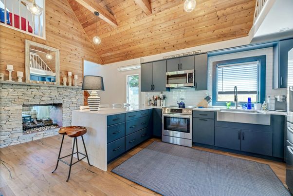 Fireplace, Interior, Kitchen, Pendant Lights, Stainless Steel Appliances, Stone Walls, Wooden Beams, Wooden Ceilings, Wood Texture Flooring, Wooden Walls