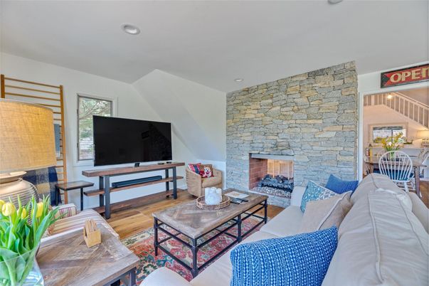 Fireplace, Interior, Living room, Recessed Lighting, Stone Walls, Wood Texture Flooring