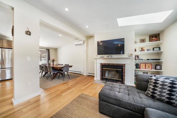 Dining room, Fireplace, Interior, Kitchen, Living room, Recessed Lighting, Stainless Steel Appliances, Wood Texture Flooring
