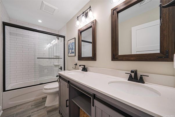 Bathroom, Dual Sink Vanities, Glass Shower, Interior, Recessed Lighting, Wood Texture Flooring