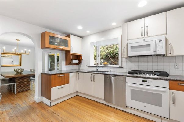 Chandelier, Dining room, Interior, Kitchen, Recessed Lighting, Stainless Steel Appliances, Wood Texture Flooring