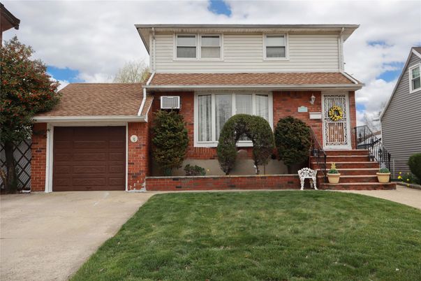 Attached, Exterior, Facade, Brick Facade, American Foursquare