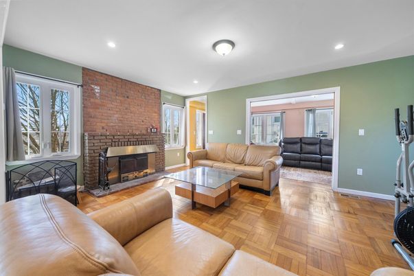 Fireplace, Interior, Living room, Recessed Lighting, Stone Walls, Wood Texture Flooring