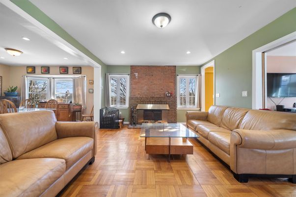 Fireplace, Interior, Living room, Recessed Lighting, Stone Walls, Wood Texture Flooring