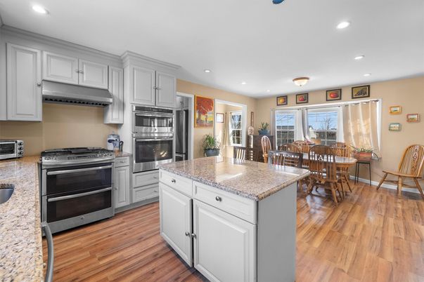 Dining room, Interior, Kitchen, Recessed Lighting, Stainless Steel Appliances, Wood Texture Flooring