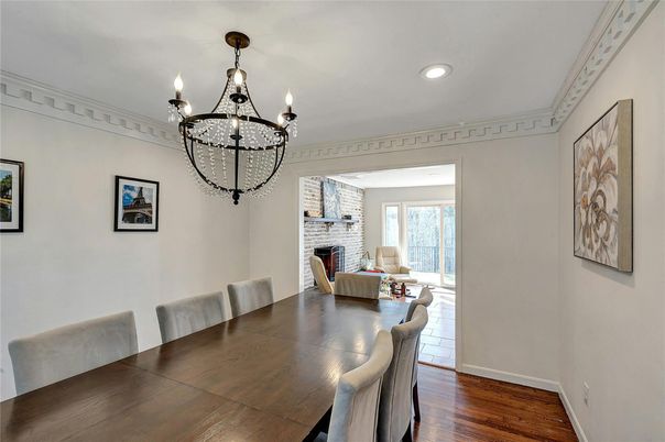 Chandelier, Dining room, Fireplace, Interior, Recessed Lighting, Stone Walls, Wood Texture Flooring