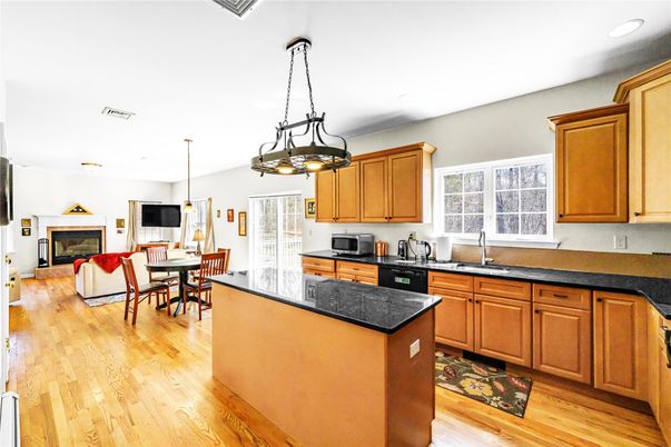 Chandelier, Dining room, Fireplace, Interior, Kitchen, Living room, Pendant Lights, Recessed Lighting, Wood Texture Flooring