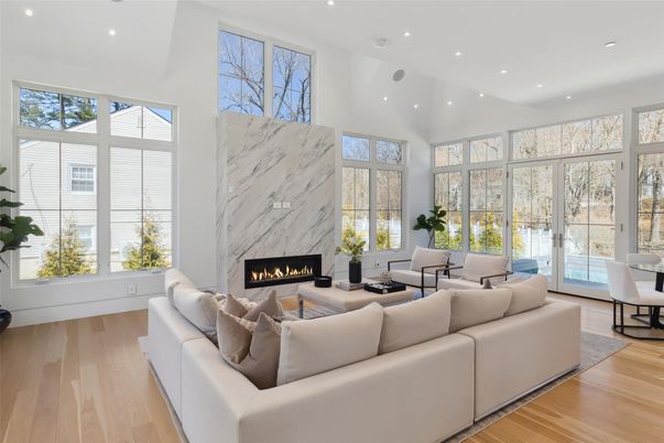 Fireplace, Interior, Living room, Marble Walls, Recessed Lighting, Wood Texture Flooring