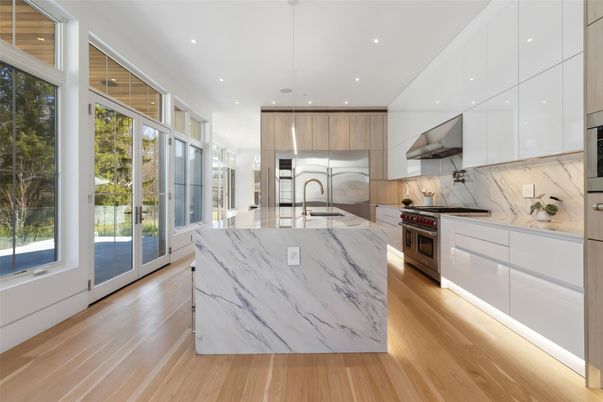 Interior, Kitchen, Marble Walls, Recessed Lighting, Stainless Steel Appliances, Wood Texture Flooring