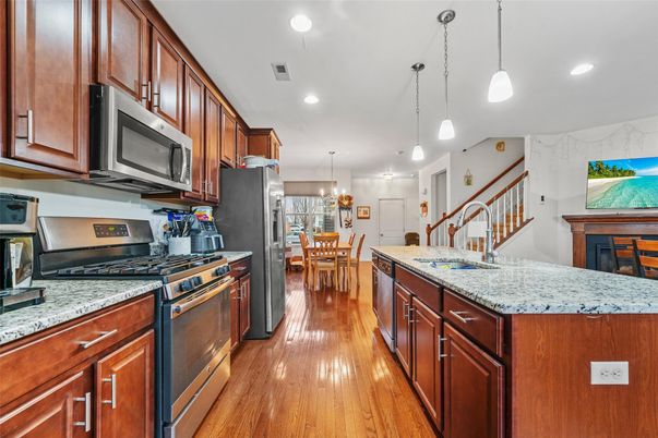 Chandelier, Dining room, Interior, Kitchen, Pendant Lights, Recessed Lighting, Stainless Steel Appliances, Wood Texture Flooring