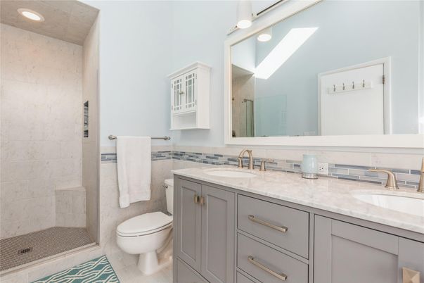 Bathroom, Dual Sink Vanities, Glass Shower, Interior, Marble Walls, Recessed Lighting