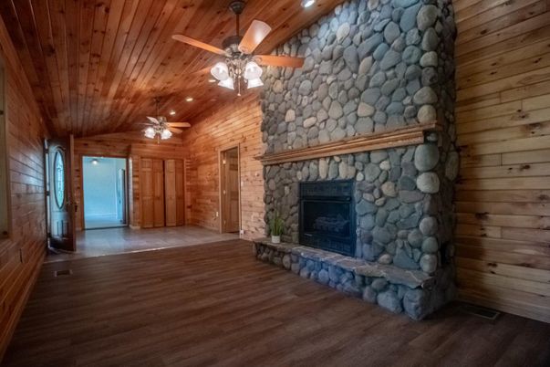 Empty room, Fireplace, Interior, Recessed Lighting, Stone Walls, Wooden Ceilings, Wood Texture Flooring, Wooden Walls