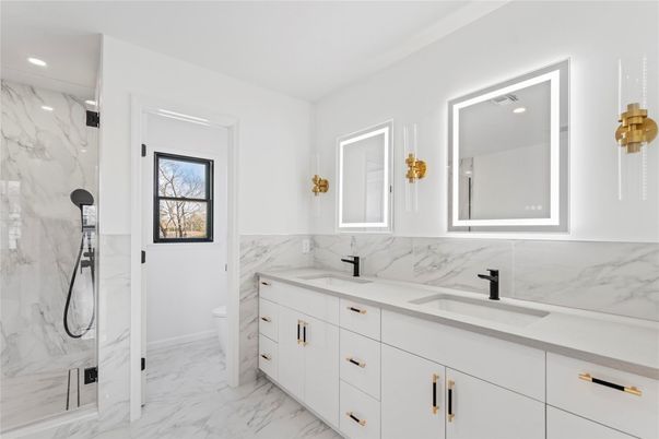 Bathroom, Dual Sink Vanities, Interior, Marble, Marble Walls, Recessed Lighting