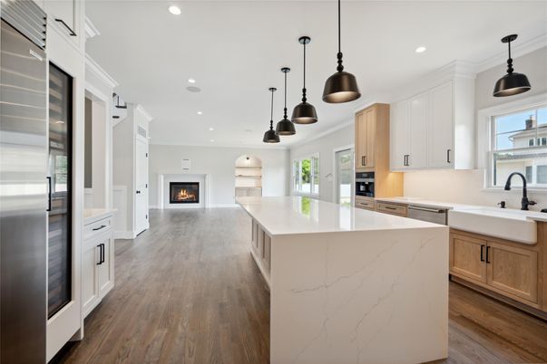 Fireplace, Interior, Kitchen, Pendant Lights, Recessed Lighting, Stainless Steel Appliances, Wood Texture Flooring
