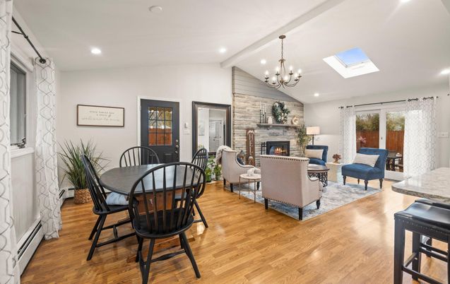 Chandelier, Dining room, Fireplace, Interior, Living room, Recessed Lighting, Stone Walls, Wood Texture Flooring