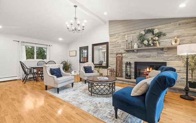 Chandelier, Dining room, Fireplace, Interior, Living room, Recessed Lighting, Stone Walls, Wood Texture Flooring
