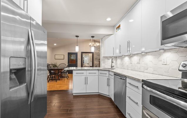 Dining room, Interior, Kitchen, Pendant Lights, Recessed Lighting, Stainless Steel Appliances, Wood Texture Flooring