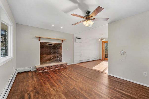 Empty room, Fireplace, Interior, Recessed Lighting, Stone Walls, Wood Texture Flooring