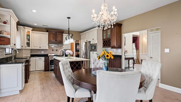 Chandelier, Dining room, Interior, Kitchen, Pendant Lights, Recessed Lighting, Stainless Steel Appliances, Wood Texture Flooring