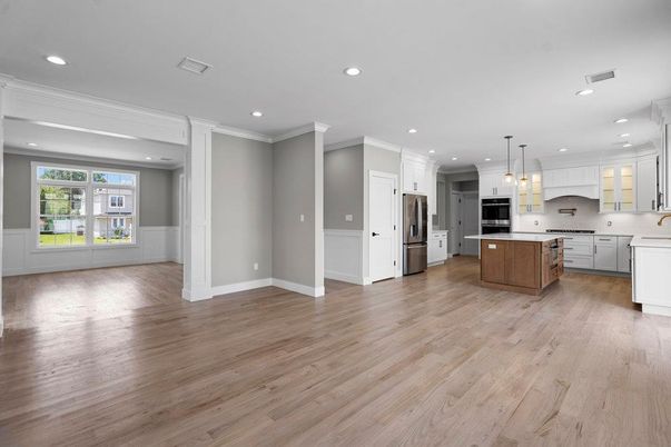 Empty room, Interior, Kitchen, Pendant Lights, Recessed Lighting, Stainless Steel Appliances, Wood Texture Flooring